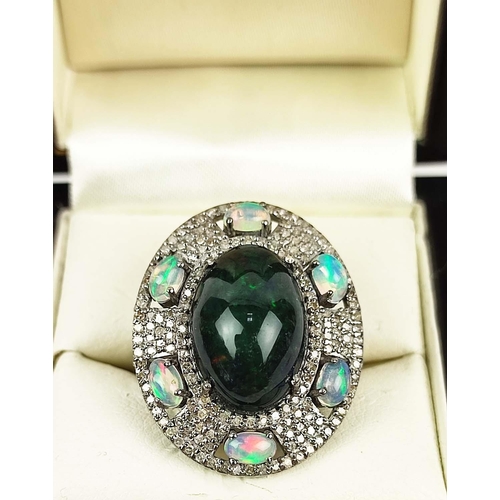 169 - A GALAXY BLACK OPAL AND WHITE OPAL DRESS RING, with diamond chips to the setting, open backed, ring ... 