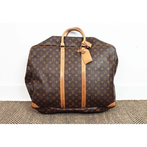 28 - LOUIS VUITTON SIRIUS TRAVEL BAG, monogram coated canvas with leather trims, handles, name tag, gold ... 