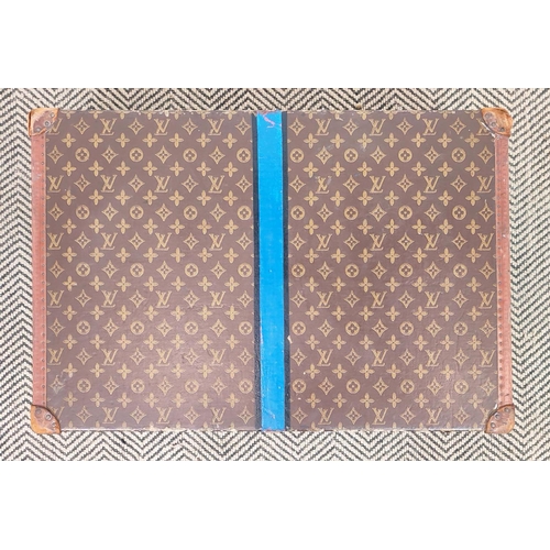 39 - LOUIS VUITTON VINTAGE HARD SUITCASE, monogrammed with leather handles and trims with decorative blue... 