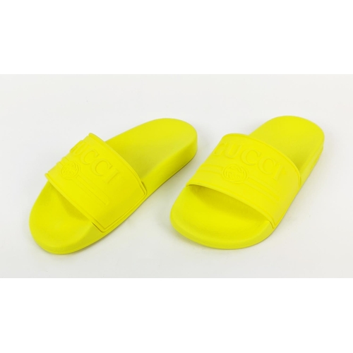 47 - GUCCI JUNIOR LOGO RUBBER SLIDERS, yellow fluo, embossed logo, rubber sole, made in Italy, size 27, w... 