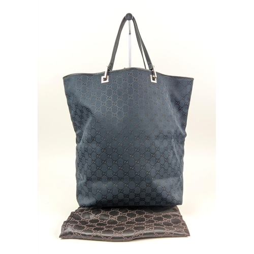 58 - GUCCI VINTAGE TOTE BAG, with iconic GG monogram canvas with leather trims and handles, silver tone h... 