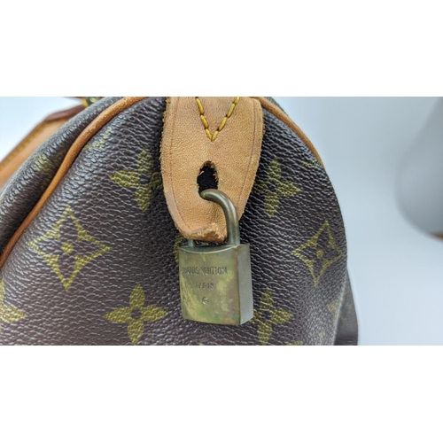 59 - LOUIS VUITTON VINTAGE SPEEDY 35 BAG, monogram coated canvas with leather trims and handles gold bras... 