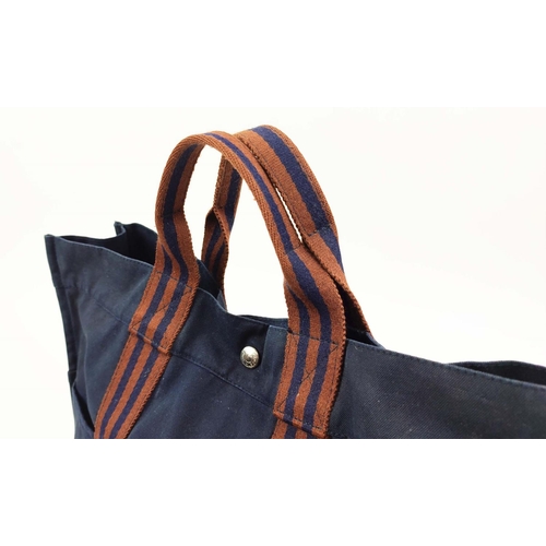 68 - HERMÈS VINTAGE DEAVILLE UNISEX TOTE BAG, blue canvas with brown/burnt stripes, snap closure, silver ... 