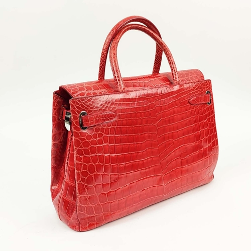 70 - ASPREY 36 BURNT ORANGE DARCY CROCODILE BAG, top handles, signature clasps on side straps, push butto... 