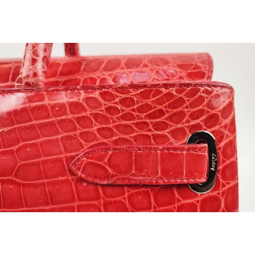 70 - ASPREY 36 BURNT ORANGE DARCY CROCODILE BAG, top handles, signature clasps on side straps, push butto... 