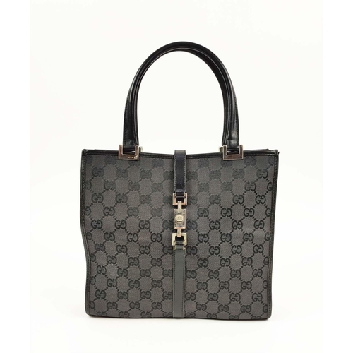 74 - GUCCI VINTAGE HANDBAG, monogram canvas with leather top handles and trims, push lock closure, silver... 