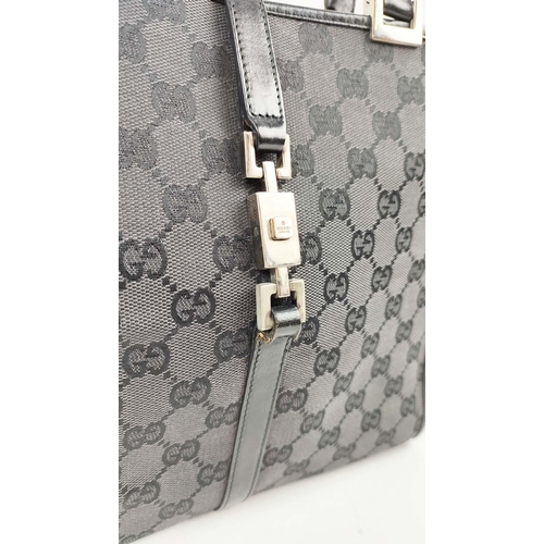 74 - GUCCI VINTAGE HANDBAG, monogram canvas with leather top handles and trims, push lock closure, silver... 