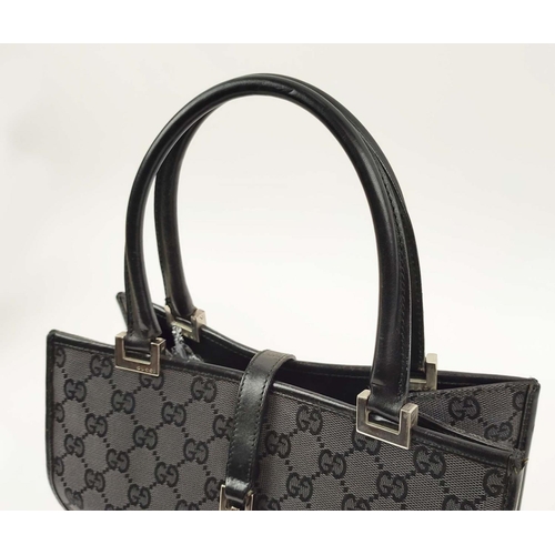 74 - GUCCI VINTAGE HANDBAG, monogram canvas with leather top handles and trims, push lock closure, silver... 