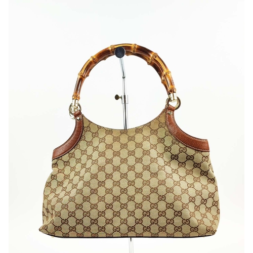 75 - GUCCI VINTAGE BAG, monogram canvas with bamboo handles and leather trims, studs detail, pale gilt me... 