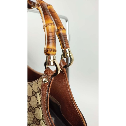 75 - GUCCI VINTAGE BAG, monogram canvas with bamboo handles and leather trims, studs detail, pale gilt me... 