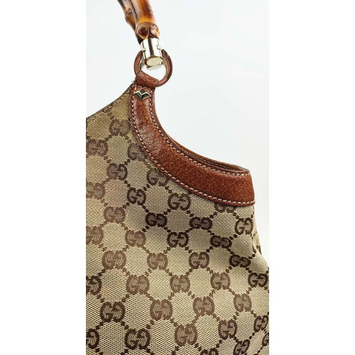 75 - GUCCI VINTAGE BAG, monogram canvas with bamboo handles and leather trims, studs detail, pale gilt me... 