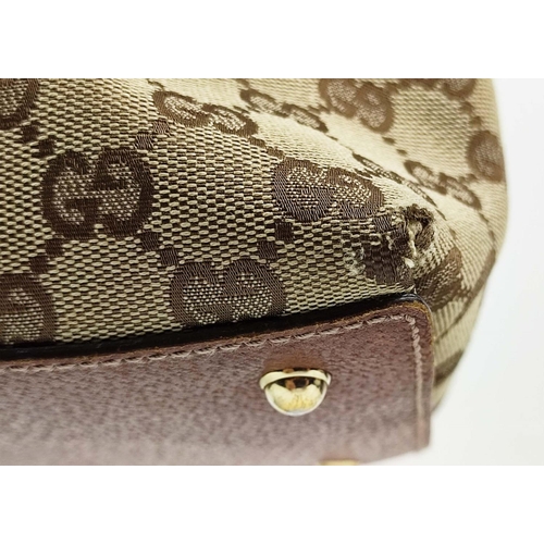 75 - GUCCI VINTAGE BAG, monogram canvas with bamboo handles and leather trims, studs detail, pale gilt me... 