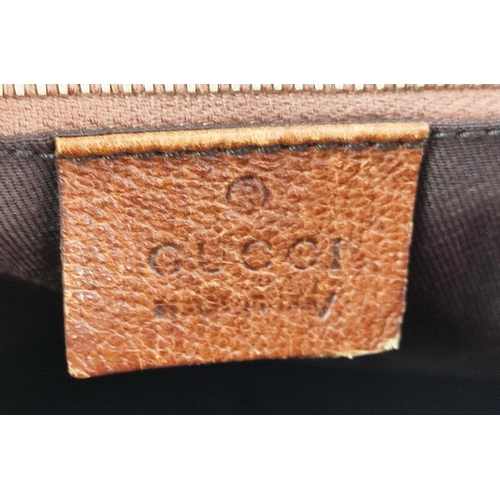 75 - GUCCI VINTAGE BAG, monogram canvas with bamboo handles and leather trims, studs detail, pale gilt me... 