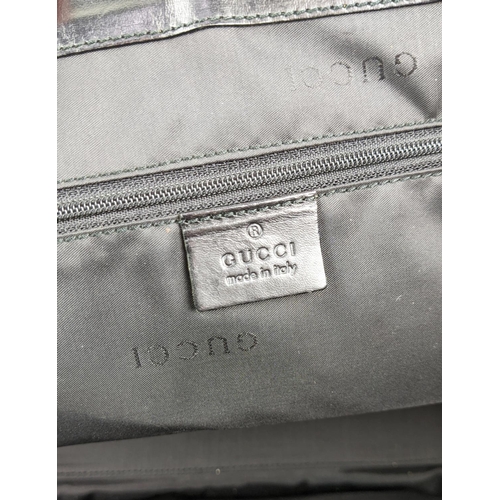 80 - GUCCI NYLON BAG, leather handle and trims, push lock closure, silver tone hardware, main open compar... 