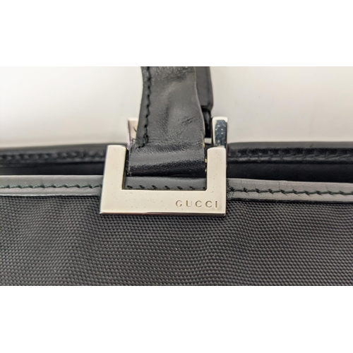 80 - GUCCI NYLON BAG, leather handle and trims, push lock closure, silver tone hardware, main open compar... 