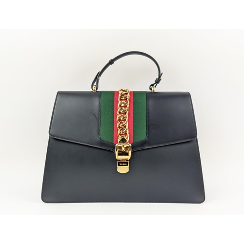 81 - GUCCI SYLVIE BAG, black leather with iconic web stripes and gold tone chain detailing on front flap,... 