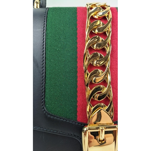 81 - GUCCI SYLVIE BAG, black leather with iconic web stripes and gold tone chain detailing on front flap,... 