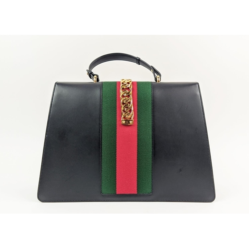 81 - GUCCI SYLVIE BAG, black leather with iconic web stripes and gold tone chain detailing on front flap,... 