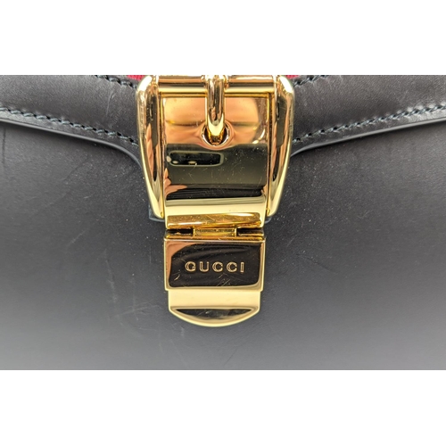 81 - GUCCI SYLVIE BAG, black leather with iconic web stripes and gold tone chain detailing on front flap,... 