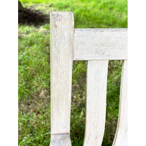 159 - GARDEN BENCH, weathered teak of slatted construction with flat top arms, 158cm W.