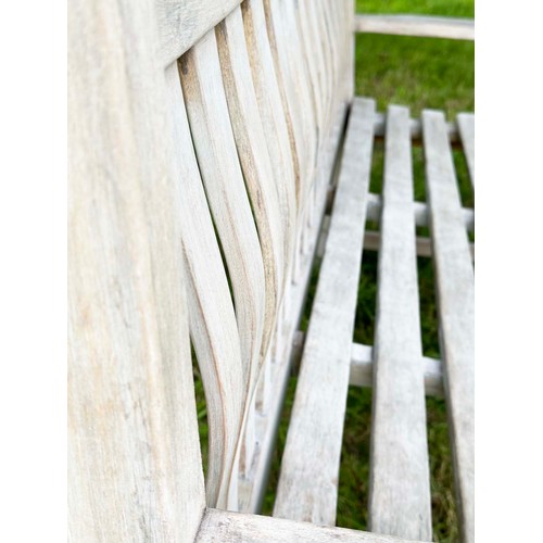 159 - GARDEN BENCH, weathered teak of slatted construction with flat top arms, 158cm W.