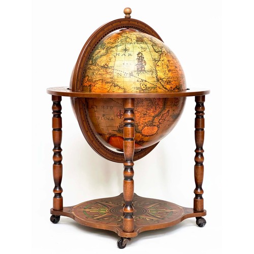 292 - GLOBE COCKTAIL CABINET, in the form of an antique terrestrial globe on stand with rising lid, and fi... 