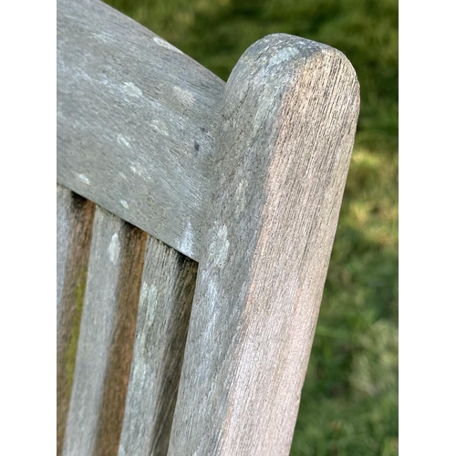 86 - GARDEN STEAMER CHAIR BY ALEXANDER ROSE, nicely weathered teak reclining with foot rest and cushions,... 