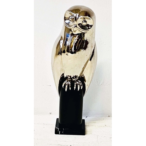 327 - CONTEMPORARY SCHOOL OWL SCULPTURE, polished metal on a marble stand, 44cm H.