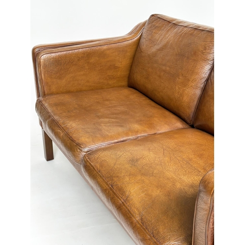 272 - SOFA, two seater grained soft natural tan brown leather with teak supports, 143cm W.