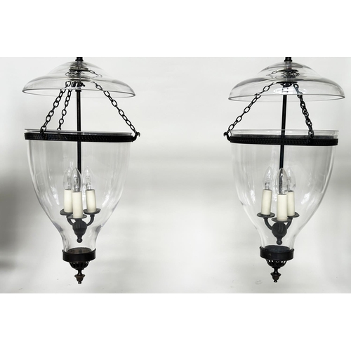 214 - VAUGHAN 'GLASS GLOBE' HALL LANTERNS, a pair, three light glass and bronzed metal, 52cm H. (2)