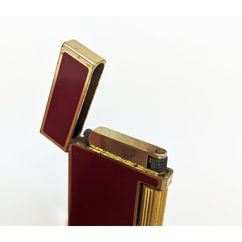 177 - FOUR VARIOUS CIGARETTE LIGHTERS, including a Christian Dior gold plated and enamelled lighter, a Dun... 