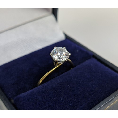 176 - AN 18CT GOLD SOLITAIRE STONE DRESS RING, the brilliant cut stone claw set in a white metal setting, ... 