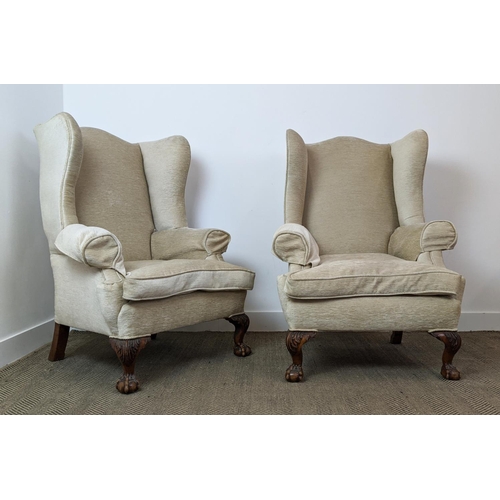 173 - WING ARMCHAIRS, a pair, early 20th century walnut, with carved claw and ball supports, each 83cm W x... 