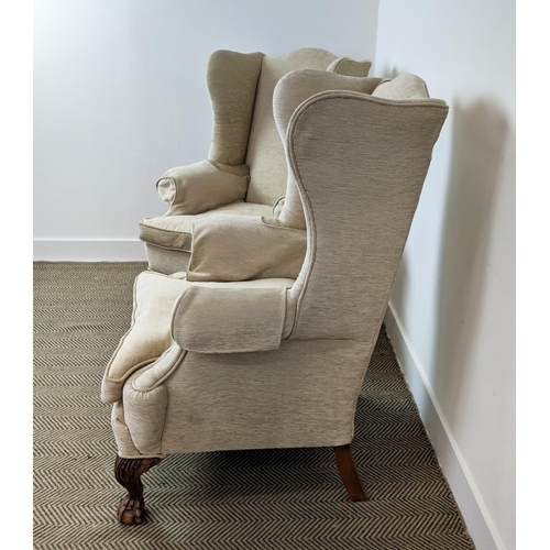 173 - WING ARMCHAIRS, a pair, early 20th century walnut, with carved claw and ball supports, each 83cm W x... 