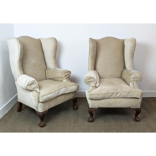 173 - WING ARMCHAIRS, a pair, early 20th century walnut, with carved claw and ball supports, each 83cm W x... 