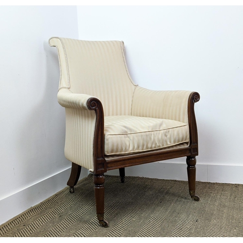 178 - LIBRARY BERGERE, Regency style mahogany in cream striped fabric on brass castors, 95cm H x 71cm.