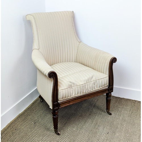 178 - LIBRARY BERGERE, Regency style mahogany in cream striped fabric on brass castors, 95cm H x 71cm.