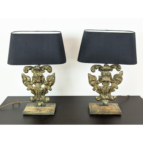 180 - TABLE LAMPS, a pair, carved giltwood bases with black shades, each 64cm tall overall including shade... 