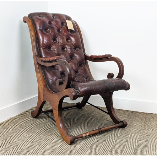 184 - LIBRARY ARMCHAIR, Regency style of sleigh form in buttoned leather upholstery, with a mahogany frame... 