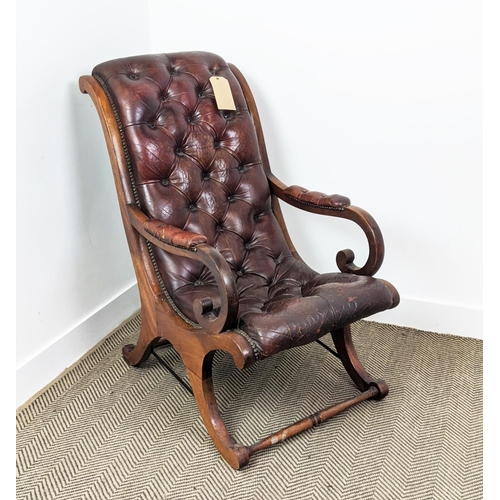 184 - LIBRARY ARMCHAIR, Regency style of sleigh form in buttoned leather upholstery, with a mahogany frame... 