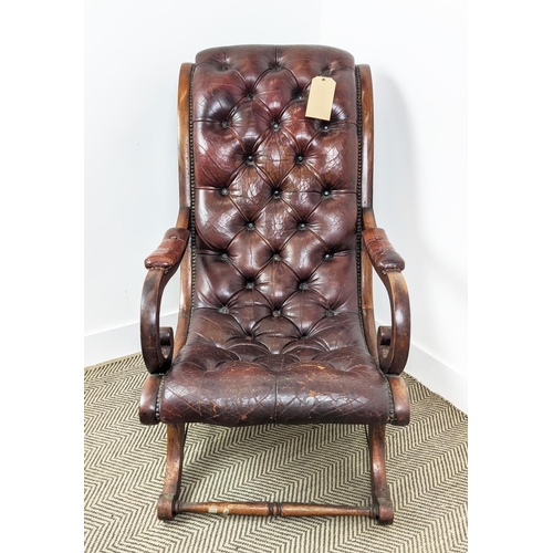 184 - LIBRARY ARMCHAIR, Regency style of sleigh form in buttoned leather upholstery, with a mahogany frame... 