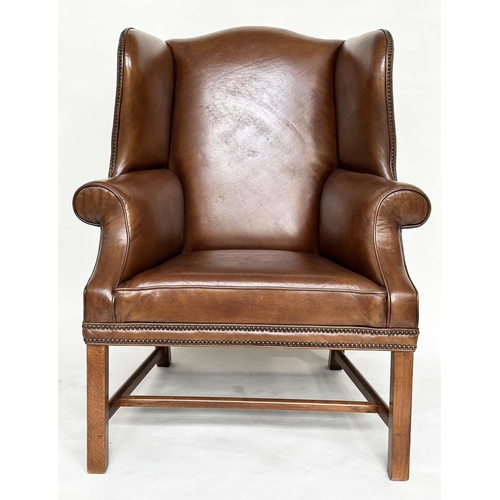 109 - WINGBACK ARMCHAIRS, a pair, George II style mahogany with hand finished brass studded antique soft b... 