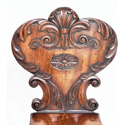 114 - HALL CHAIRS, a pair, Regency mahogany each with carved backs above oval recessed panel seats and out... 