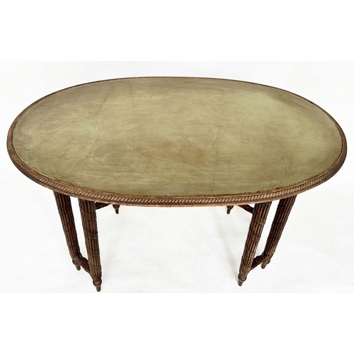 118 - CENTRE WRITING TABLE, early 20th century oak with oval leather inset writing surface above four pair... 