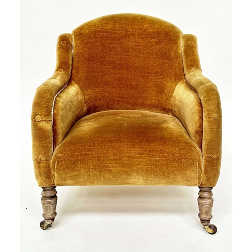 119 - ARMCHAIR, Victorian green velvet with buttoned downswept arms and turned front feet.