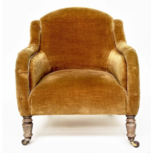 119 - ARMCHAIR, Victorian green velvet with buttoned downswept arms and turned front feet.