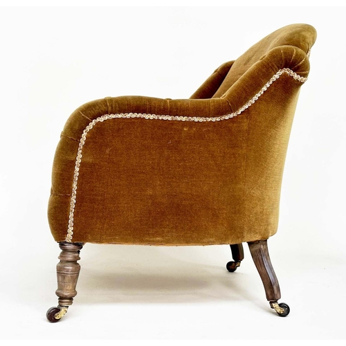 119 - ARMCHAIR, Victorian green velvet with buttoned downswept arms and turned front feet.