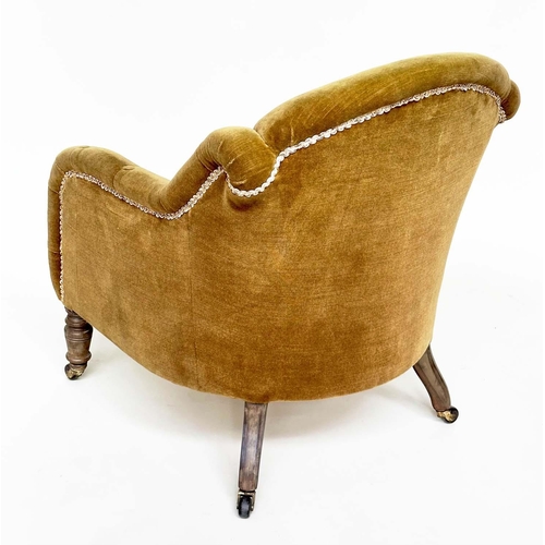 119 - ARMCHAIR, Victorian green velvet with buttoned downswept arms and turned front feet.