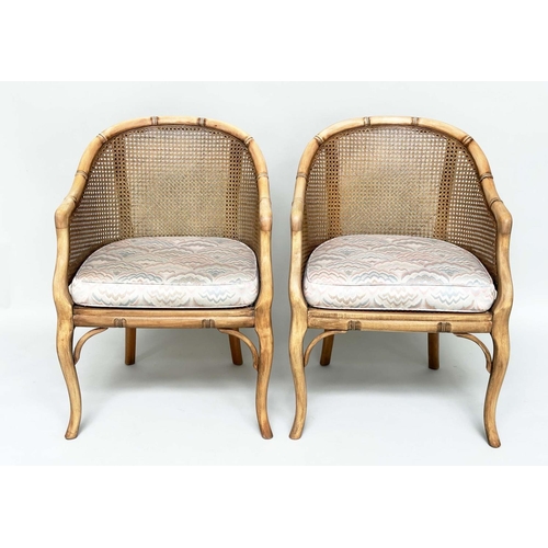 125 - FAUX BAMBOO CONSERVATORY ARMCHAIRS, a pair, with arched backs and cane panelling, 60cm W. (2)