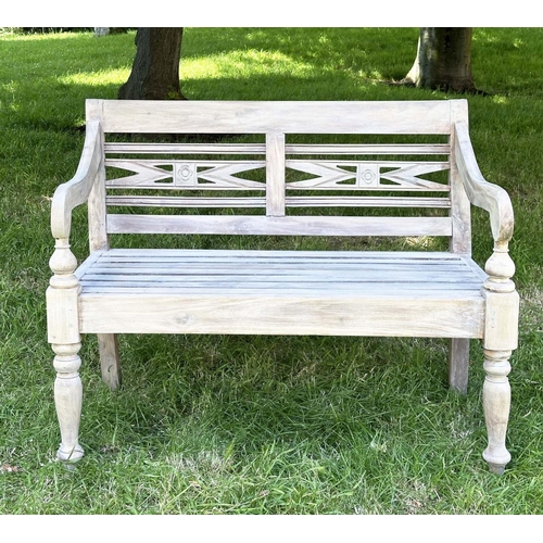 127 - COLONIAL STYLE GARDEN BENCH, weathered teak with inset twin panelled back downswept scroll arms and ... 